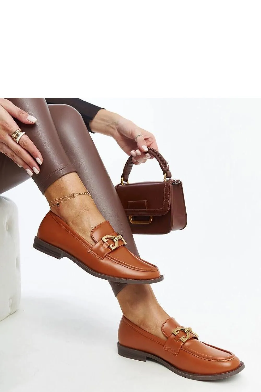 Brown Lea moccasins with a buckle